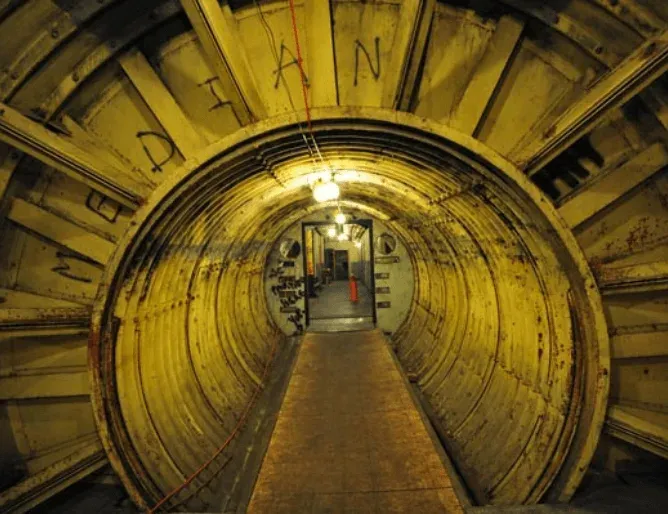 Illuminated underground access tunnel