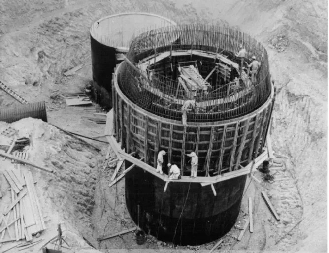 Historic construction with worker for scale